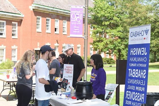 Photo of activities fair on Chatham University's Shadyside Campus, showing the Chabad House table